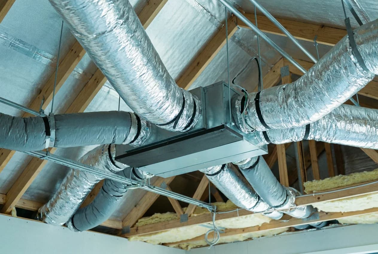 Residential ducted air conditioning system in a roof space